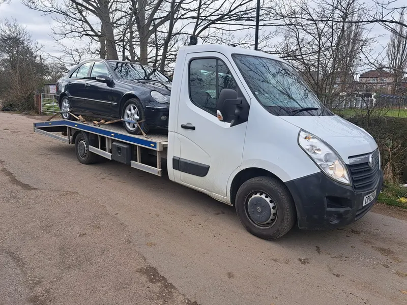 Recovery truck collecting a scrap car near Kendal